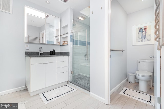 1690 Chimney House Rd, Reston, VA 20190 - full bath with vanity, a stall shower, and wood finished floors
