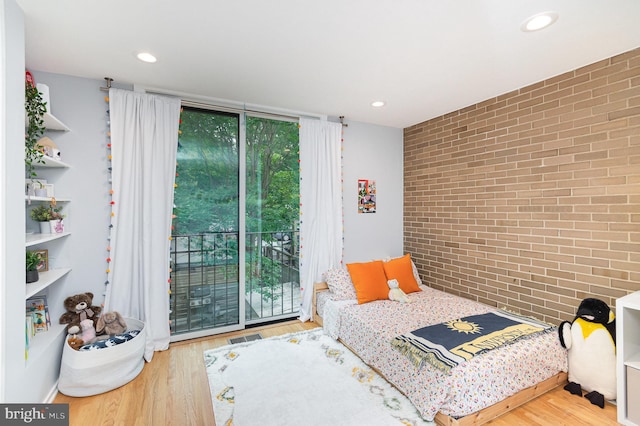 1690 Chimney House Rd, Reston, VA 20190 - bedroom with brick wall, wood finished floors, access to outside, and recessed lighting