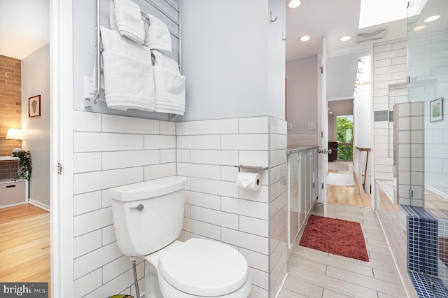 1690 Chimney House Rd, Reston, VA 20190 - full bath featuring tile walls, recessed lighting, vanity, and tile patterned floors