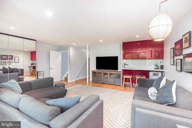 1690 Chimney House Rd, Reston, VA 20190 - living room with light wood-type flooring, stairs, recessed lighting, and a dry bar