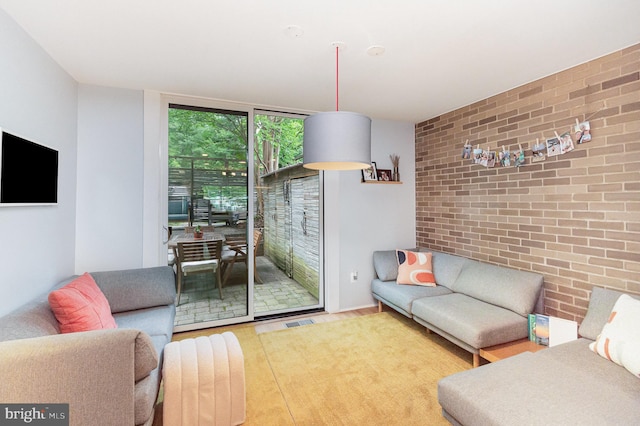1690 Chimney House Rd, Reston, VA 20190 - living area with brick wall and a wall of windows