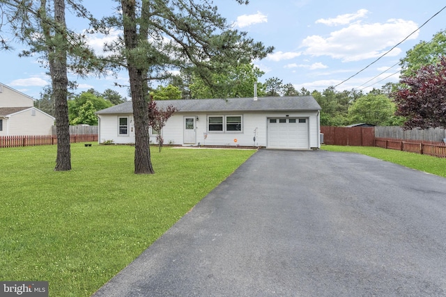 54 Tecumseh Trl, Browns Mills, NJ 08015 - view of front of home with an attached garage and asphalt driveway