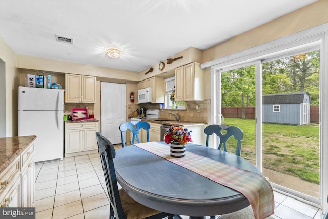 54 Tecumseh Trl, Browns Mills, NJ 08015 - dining room with light tile patterned flooring and plenty of natural light