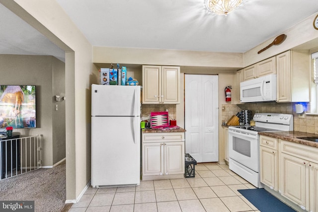 54 Tecumseh Trl, Browns Mills, NJ 08015 - kitchen with white appliances, cream cabinets, decorative backsplash, light tile patterned floors, and baseboards