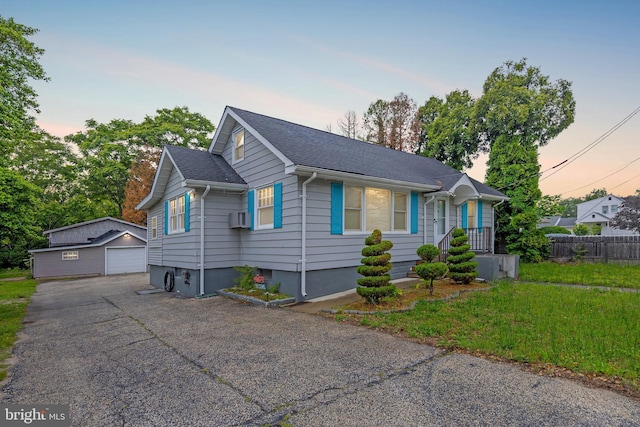 724 S W Ave, Vineland, NJ 08360 - view of front of house with a garage, an outbuilding, and a shingled roof