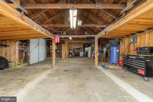 724 S W Ave, Vineland, NJ 08360 - garage featuring water heater and a workshop area
