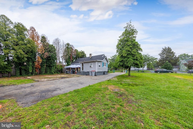 724 S W Ave, Vineland, NJ 08360 - view of front facade featuring asphalt driveway and a chimney