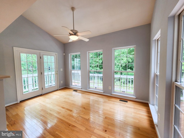 9120 Stonegarden Dr, Lorton, VA 22079 - empty room with light wood-style floors, plenty of natural light, a ceiling fan, and vaulted ceiling