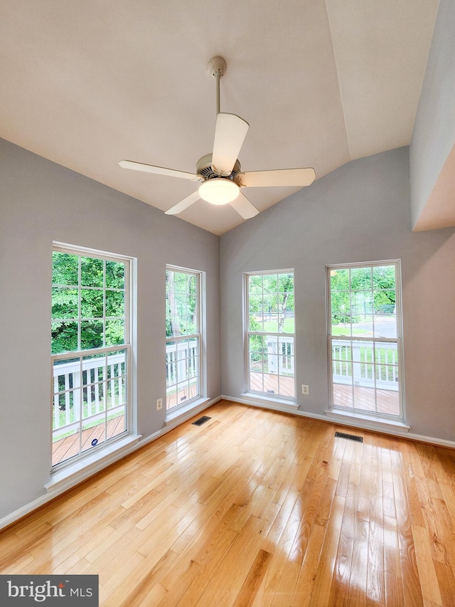 9120 Stonegarden Dr, Lorton, VA 22079 - empty room featuring hardwood / wood-style floors, a ceiling fan, lofted ceiling, and baseboards