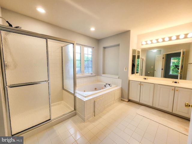 9120 Stonegarden Dr, Lorton, VA 22079 - full bath featuring tile patterned floors, a whirlpool tub, a shower stall, double vanity, and recessed lighting