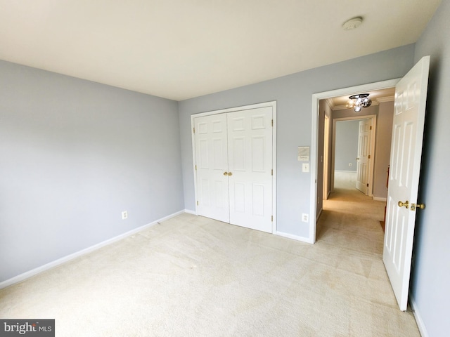 9120 Stonegarden Dr, Lorton, VA 22079 - unfurnished bedroom with light colored carpet, baseboards, and a closet