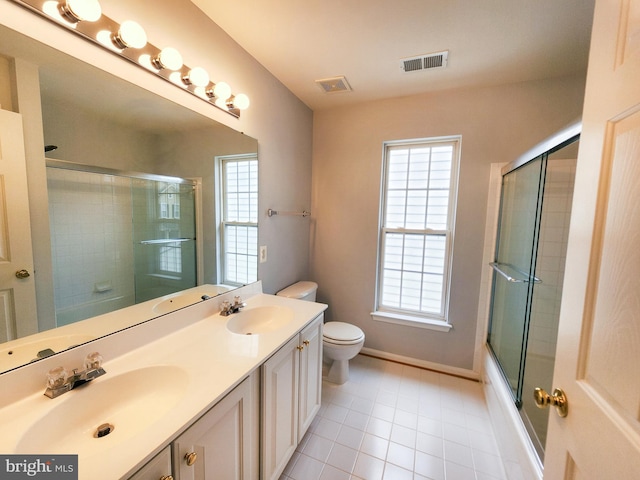 9120 Stonegarden Dr, Lorton, VA 22079 - bathroom with toilet, tile patterned flooring, double vanity, bath / shower combo with glass door, and baseboards