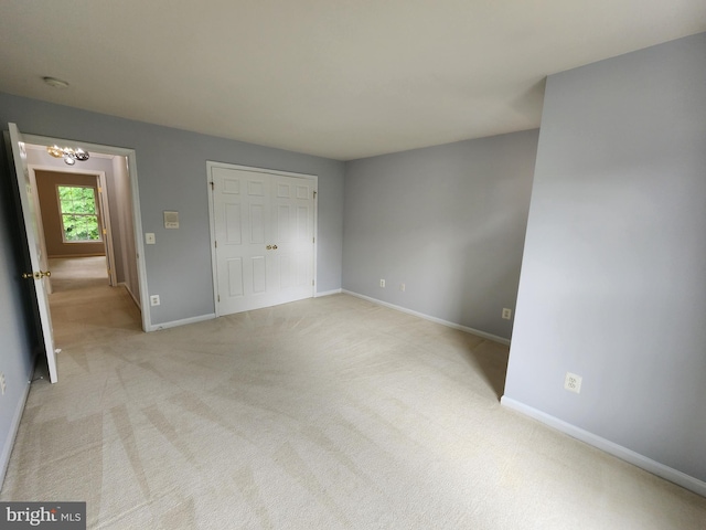 9120 Stonegarden Dr, Lorton, VA 22079 - unfurnished bedroom featuring baseboards, carpet floors, and a chandelier