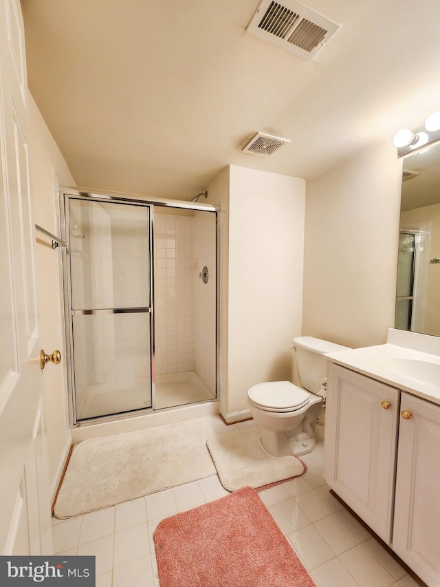 9120 Stonegarden Dr, Lorton, VA 22079 - bathroom with vanity, toilet, a shower stall, and tile patterned flooring