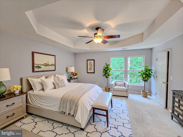 9120 Stonegarden Dr, Lorton, VA 22079 - bedroom with a tray ceiling, light carpet, baseboards, and ceiling fan