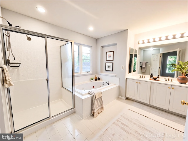 9120 Stonegarden Dr, Lorton, VA 22079 - full bath featuring a stall shower, a jetted tub, healthy amount of natural light, double vanity, and recessed lighting