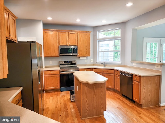 9120 Stonegarden Dr, Lorton, VA 22079 - kitchen with appliances with stainless steel finishes, light wood-type flooring, light countertops, recessed lighting, and a sink