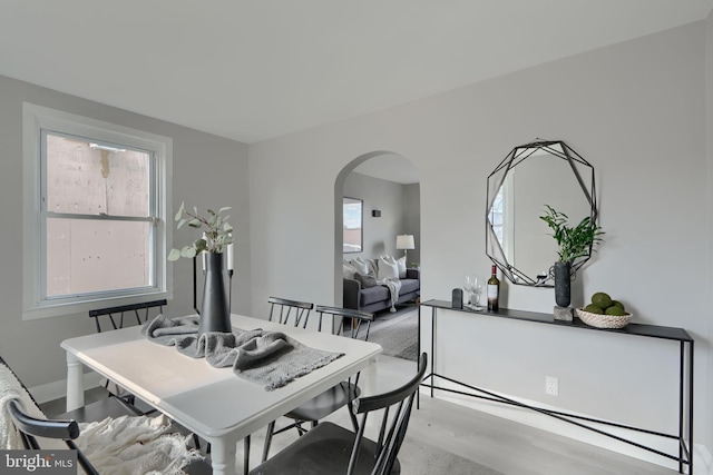 518 Fairview Ave, Baltimore, MD 21224 - dining space featuring arched walkways and light wood finished floors