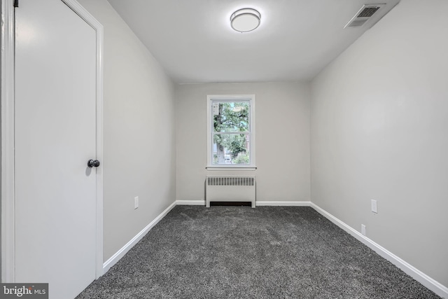 6505 Corkley Rd, Baltimore, MD 21237 - carpeted spare room featuring radiator and baseboards