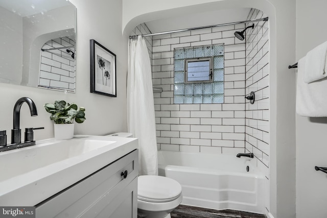 6505 Corkley Rd, Baltimore, MD 21237 - full bath with toilet, vanity, shower / tub combo, and wood finished floors
