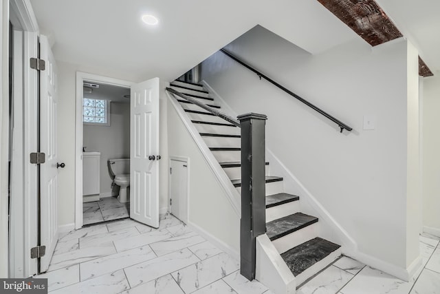 6505 Corkley Rd, Baltimore, MD 21237 - staircase with marble look tile flooring and baseboards