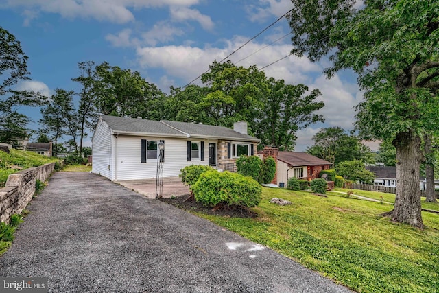 6505 Corkley Rd, Baltimore, MD 21237 - view of front of house featuring a front lawn and a chimney