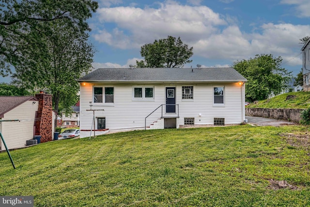 6505 Corkley Rd, Baltimore, MD 21237 - rear view of house with a lawn