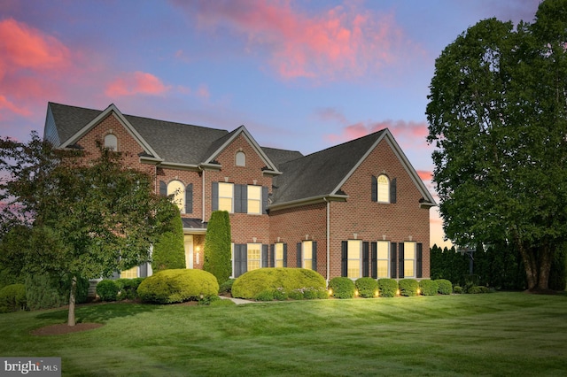 14894 Michele Dr, Glenelg, MD 21737 - colonial house featuring brick siding, a front lawn, and roof with shingles