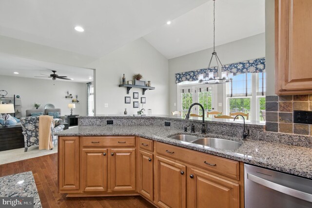 14894 Michele Dr, Glenelg, MD 21737 - kitchen with dishwasher, a sink, light stone countertops, lofted ceiling, and a chandelier