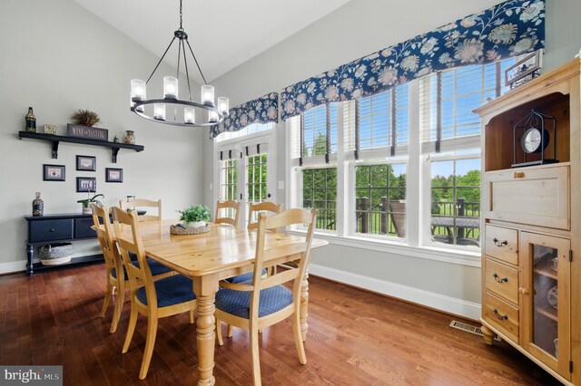14894 Michele Dr, Glenelg, MD 21737 - dining area with baseboards, a chandelier, lofted ceiling, french doors, and wood finished floors