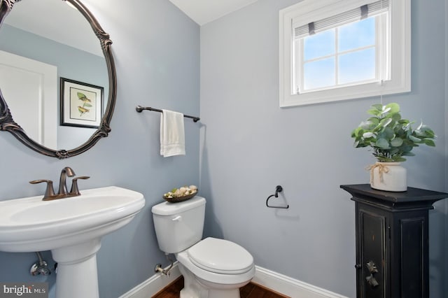 14894 Michele Dr, Glenelg, MD 21737 - half bath with baseboards, toilet, and wood finished floors