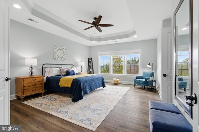 14894 Michele Dr, Glenelg, MD 21737 - bedroom featuring a tray ceiling, ornamental molding, hardwood / wood-style flooring, recessed lighting, and baseboards