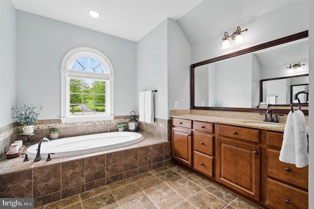 14894 Michele Dr, Glenelg, MD 21737 - full bathroom featuring vanity, a garden tub, and stone finish floors