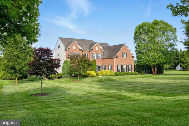 14894 Michele Dr, Glenelg, MD 21737 - view of front of property with brick siding and a front lawn