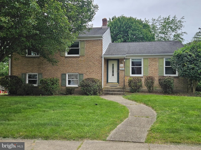 17 Ferncliff Rd, Newark, DE 19711 - tri-level home featuring brick siding, a front yard, a chimney, and a shingled roof