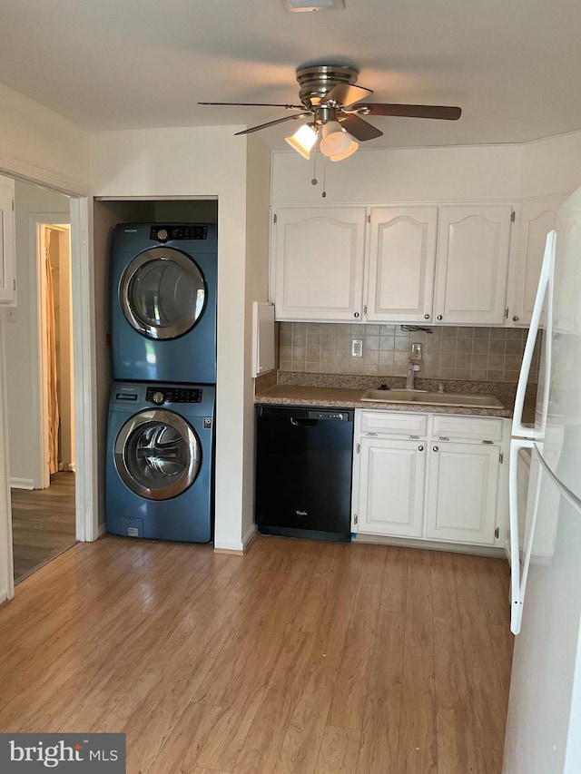 1002 Brinker Dr Unit 101, Hagerstown, MD 21740 - kitchen featuring dishwasher, stacked washer / dryer, freestanding refrigerator, ceiling fan, and white cabinetry