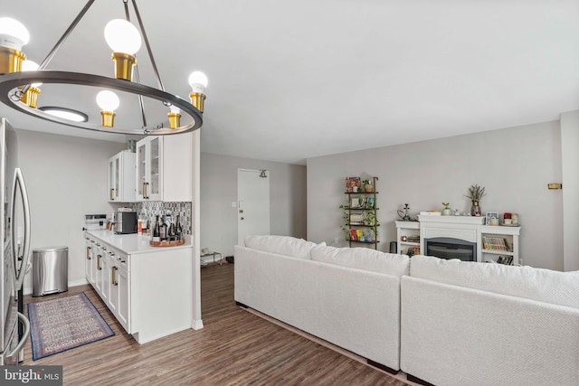1200 S Arlington Ridge Rd Unit 314, Arlington, VA 22202 - living area with wood finished floors, a glass covered fireplace, and baseboards