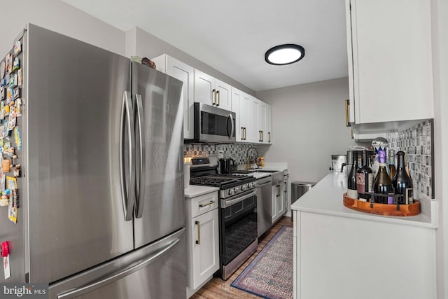 1200 S Arlington Ridge Rd Unit 314, Arlington, VA 22202 - kitchen featuring stainless steel appliances, wood finished floors, light countertops, and backsplash