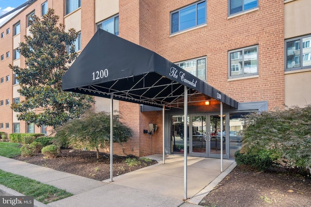 1200 S Arlington Ridge Rd Unit 314, Arlington, VA 22202 - doorway to property featuring brick siding and french doors