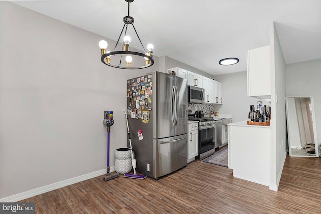 1200 S Arlington Ridge Rd Unit 314, Arlington, VA 22202 - kitchen featuring appliances with stainless steel finishes, dark wood-type flooring, white cabinetry, decorative backsplash, and baseboards
