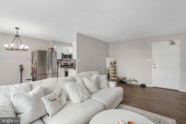 1200 S Arlington Ridge Rd Unit 314, Arlington, VA 22202 - living room featuring a chandelier, wood finished floors, and baseboards