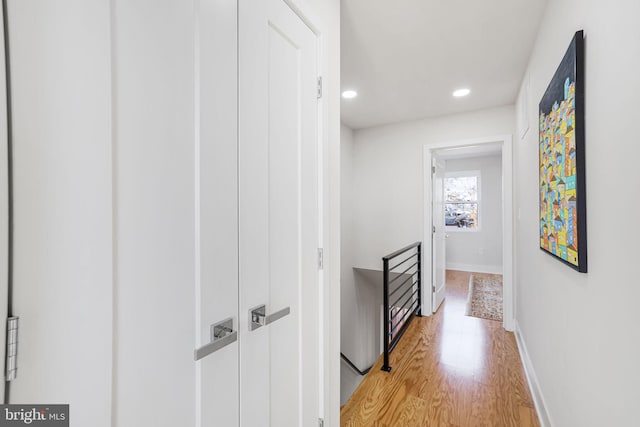 2220 13th St NE, Washington, DC 20018 - corridor with an upstairs landing, light wood finished floors, recessed lighting, and baseboards