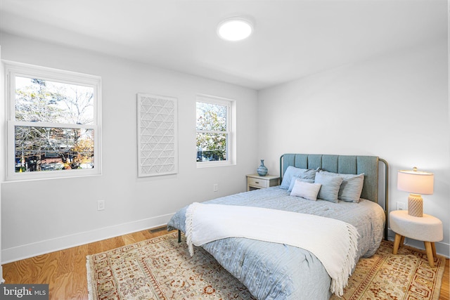 2220 13th St NE, Washington, DC 20018 - bedroom with baseboards and light wood-type flooring