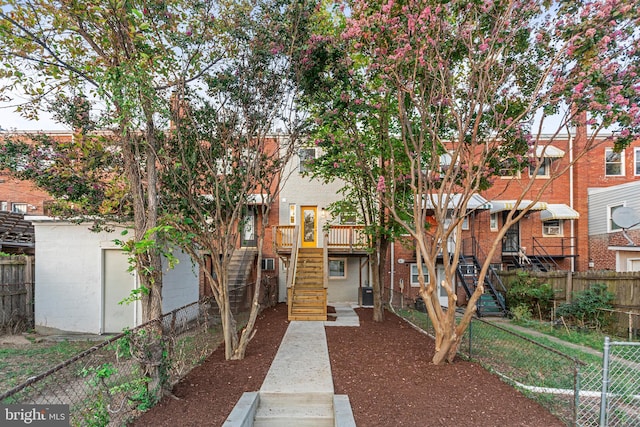 2220 13th St NE, Washington, DC 20018 - view of front facade featuring stairway, a fenced backyard, a wooden deck, and cooling unit
