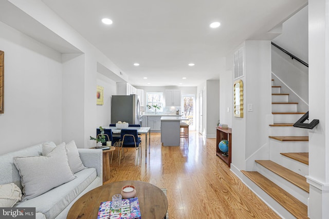 2220 13th St NE, Washington, DC 20018 - living area featuring light wood-style flooring, recessed lighting, and stairs