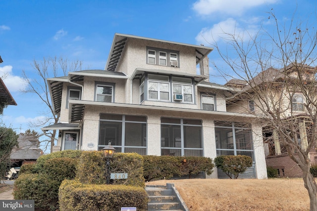 840 Riverside Ave, Trenton, NJ 08618 - view of front of home with stucco siding, a sunroom, and cooling unit