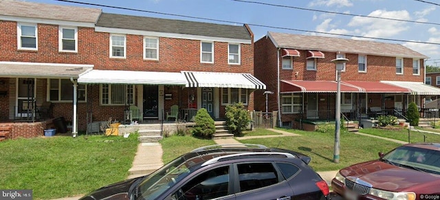 6622 Marne Ave, Baltimore, MD 21224 - multi unit property featuring brick siding and a front lawn