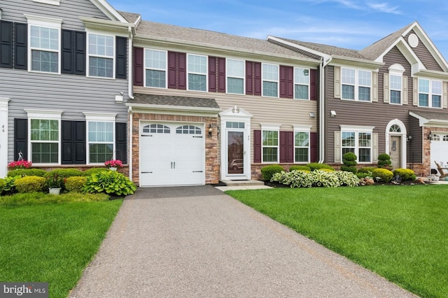 44 Heals Farm Rd, Burlington, NJ 08016 - townhome / multi-family property featuring asphalt driveway, a front yard, an attached garage, and a shingled roof