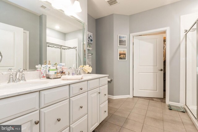44 Heals Farm Rd, Burlington, NJ 08016 - bathroom featuring a stall shower, double vanity, tile patterned flooring, and baseboards