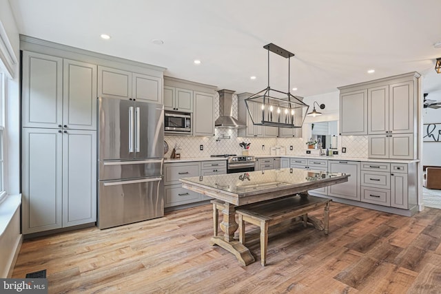 1343 Arabis Ct, Belcamp, MD 21017 - kitchen with appliances with stainless steel finishes, gray cabinets, wall chimney exhaust hood, light countertops, and decorative backsplash